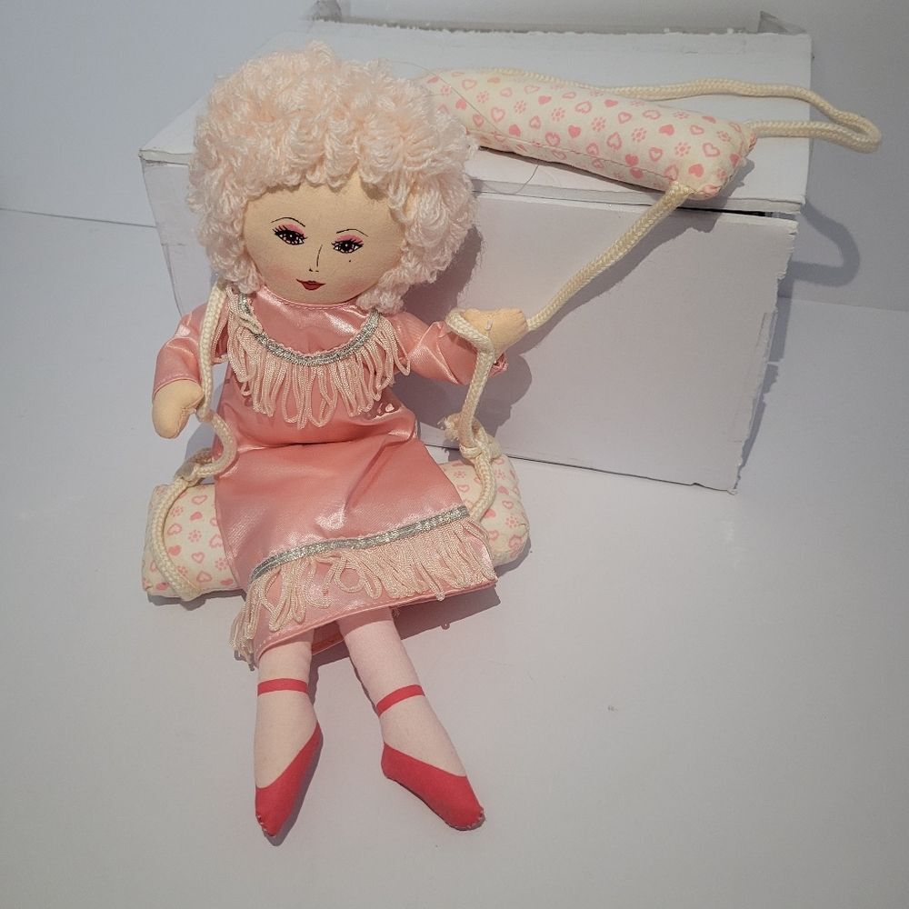 vintage Russ Berrie hanging Pink Trapeze doll on a swing